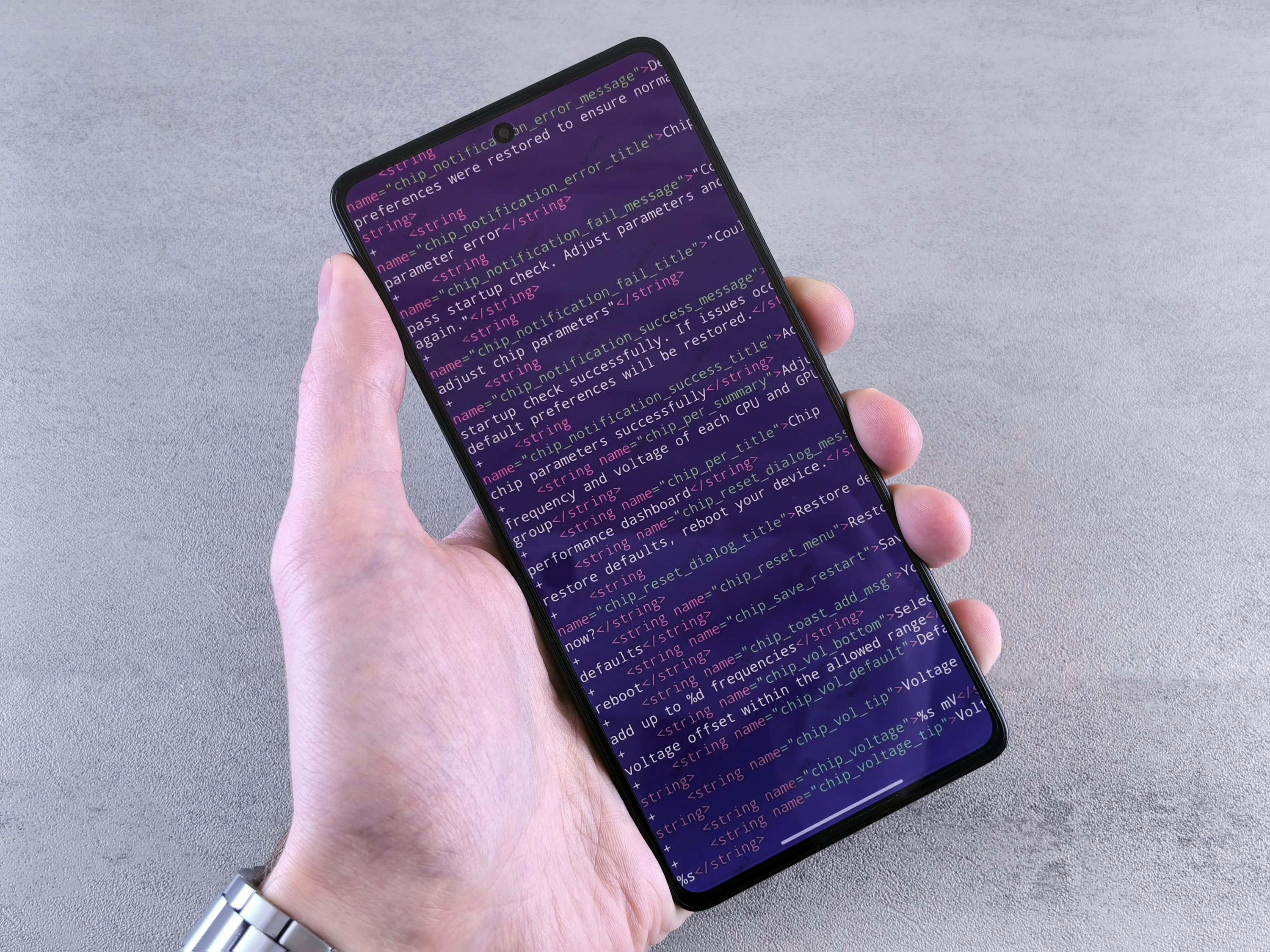 Mobile engineer reviewing release health, rollout controls, and device test results before launch